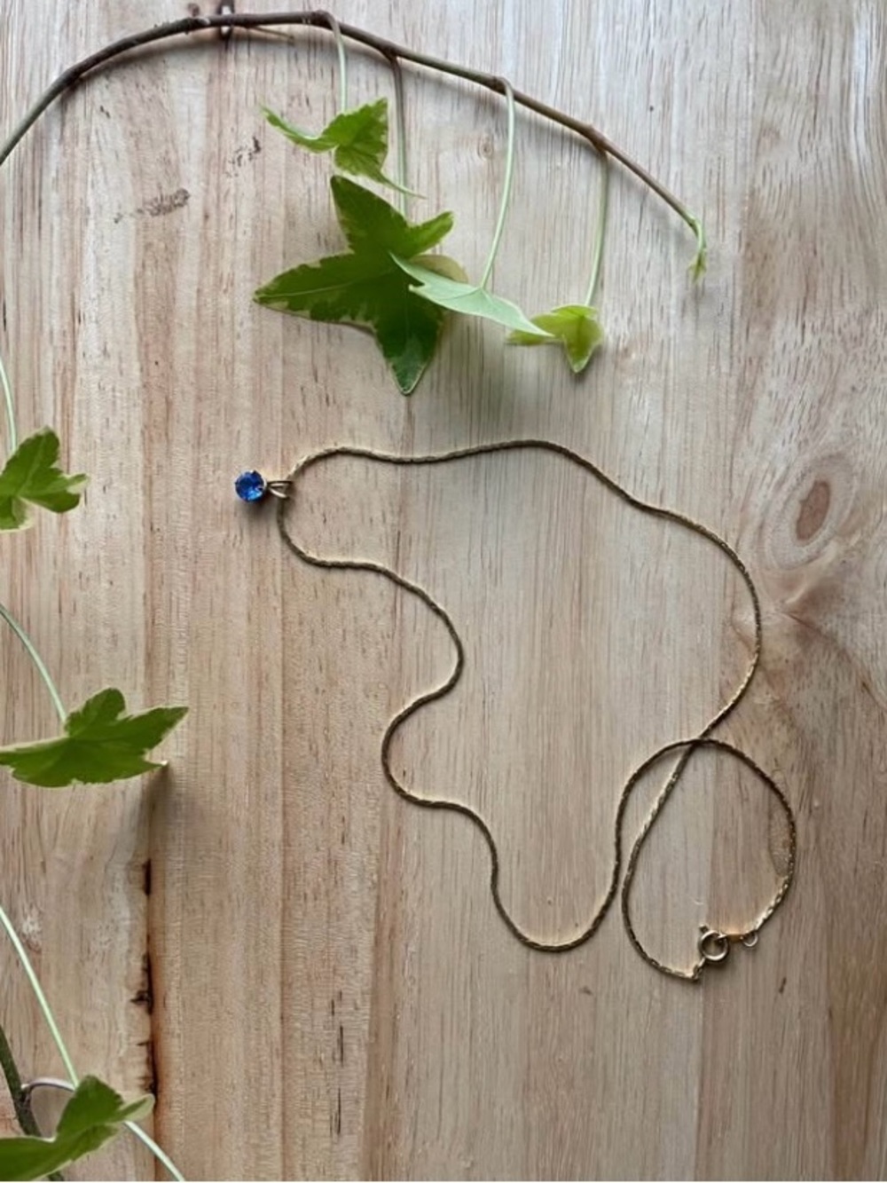 Delicate Gold Necklace with Blue Crystal Pendant